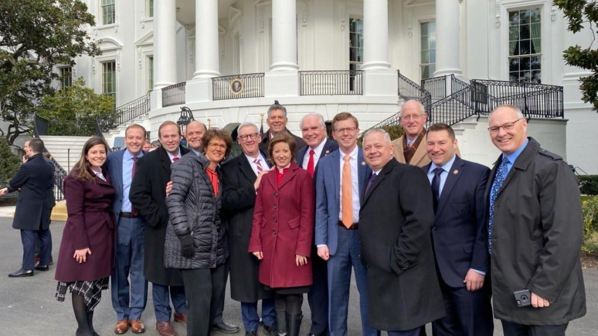 Johnson at the White House with other House members instrumental in USMCA passage