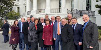 Johnson at the White House with other House members instrumental in USMCA passage